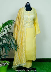 Yellow Muslin Emnroidered Suit With Cotton Bottom And Muslin Scallop Dupatta